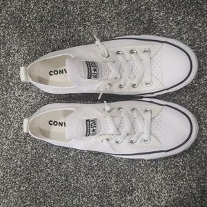 White slip on All Star Converse sneakers